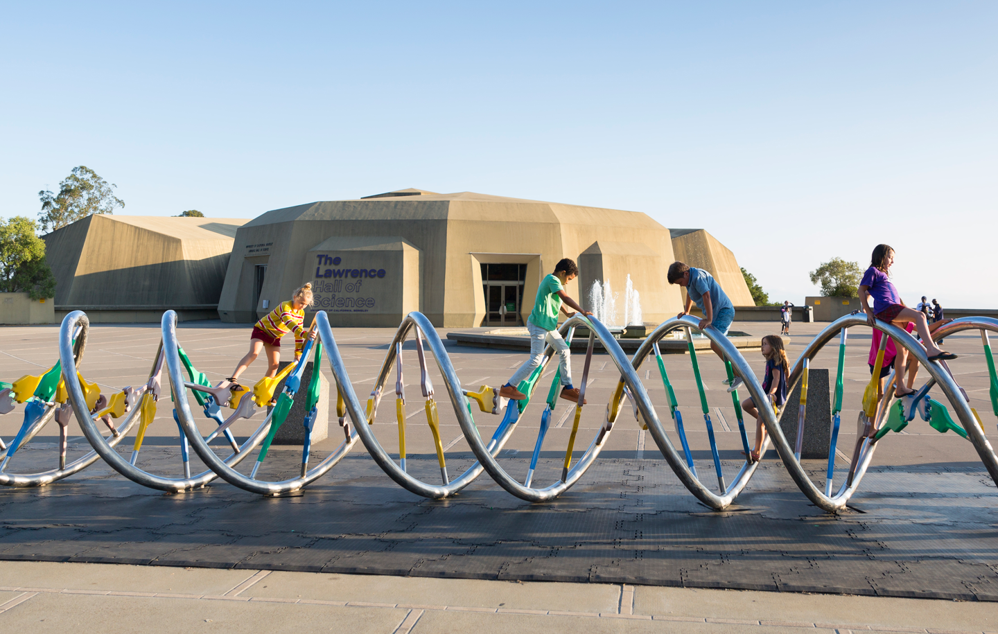 Children climbing on the DNA Sculpture at The Lawrence Hall of Science