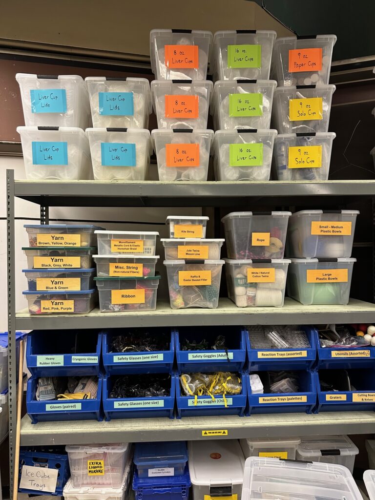 Prep hub supplies including assorted sized cups, yarns, and more.