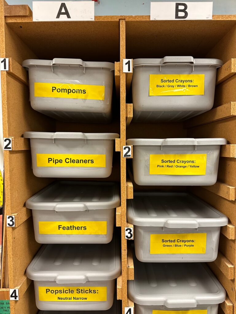 Prep hub supplies including sorted crayons and more.